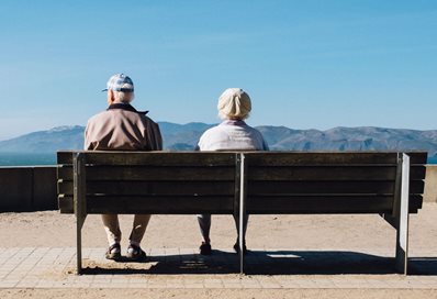 Elderly couple on park bench. Photo by Matthew Bennett on Unsplash
