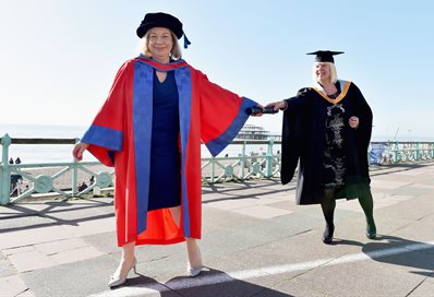 Passing the baton - Sarah Hogg presents Jennie Price with her Honorary Doctor of Letters