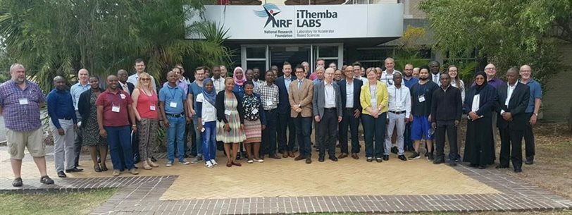 Professor Alison Bruce outside iThemba LABS with workshop delegates