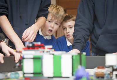School children watching Lego League