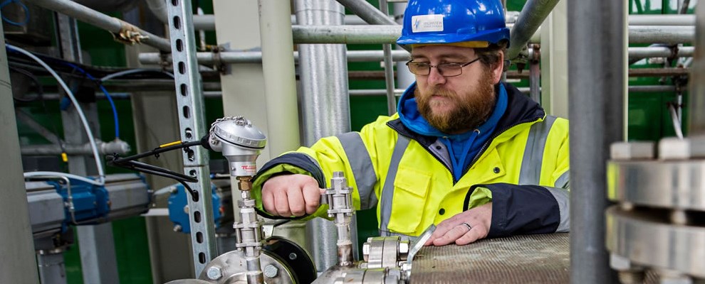 Researcher Tim Gardhouse in high vis working at Highview power plant