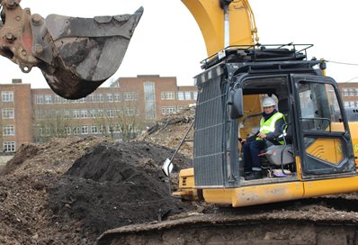 Vice-Chancellor Professor Humphris takes the controls of an excavator