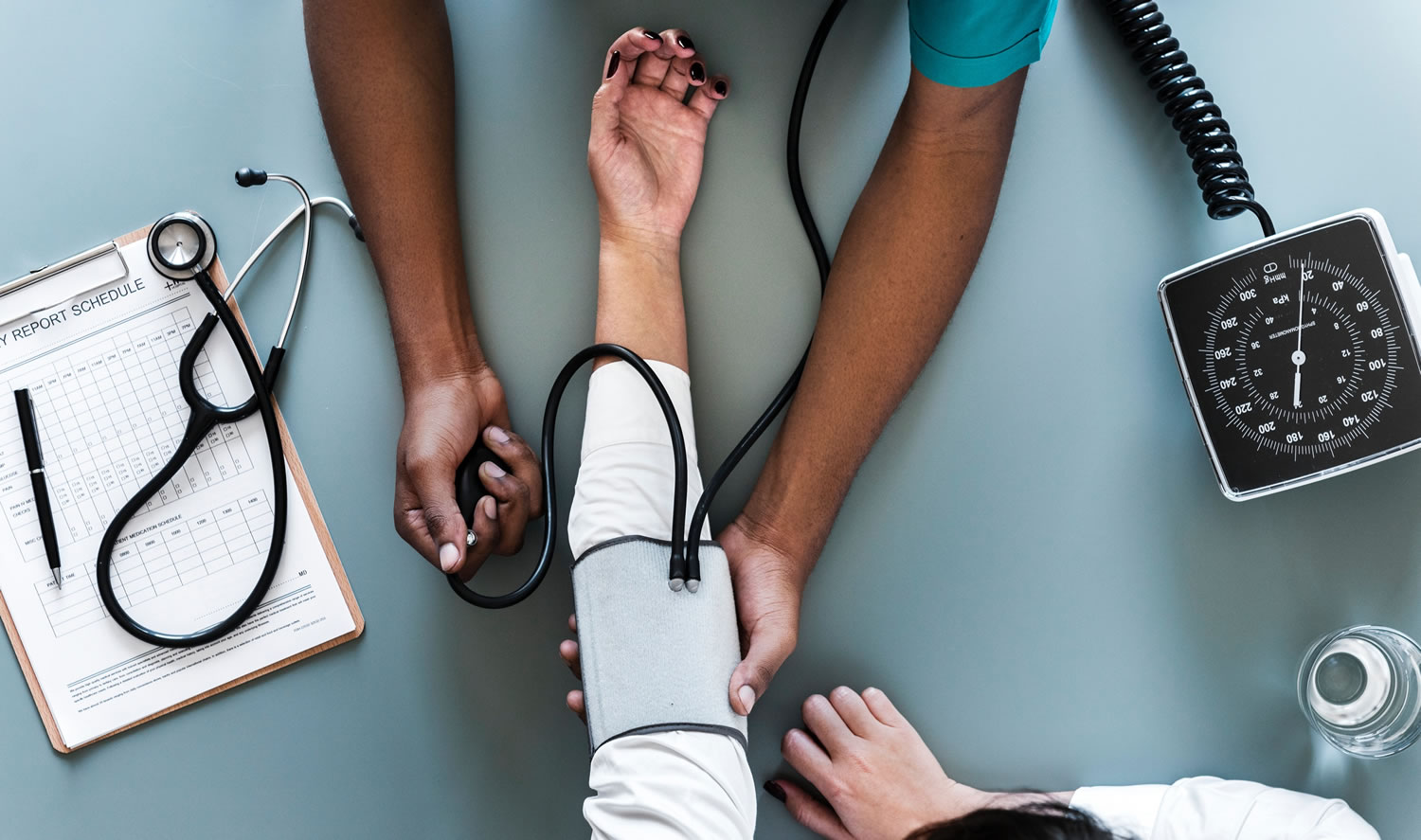 Taking blood pressure photo by rawpixel.com on Unsplash