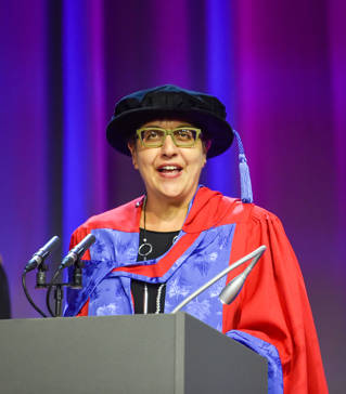 Benita Mehra speaking at graduation