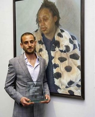 Charlie with the award and his painting