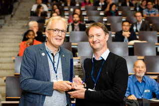 Dr James Ebdon accepts the award on behalf of Professor Huw Taylor