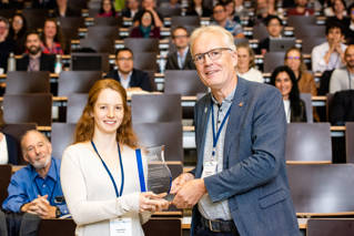 Laura Braun accepts the Professor Huw Taylor award