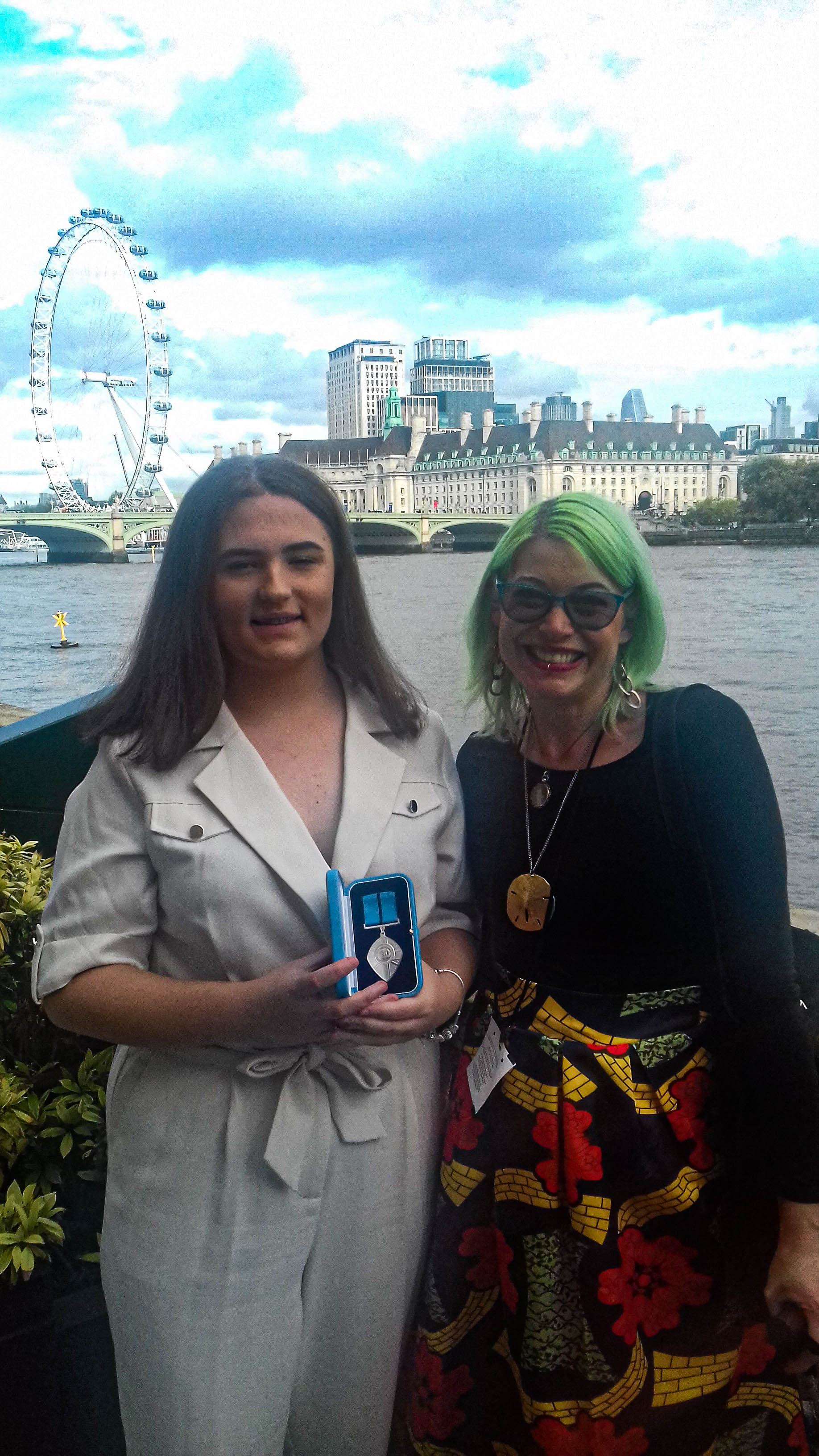 Mirika (right) and Ellie with her award
