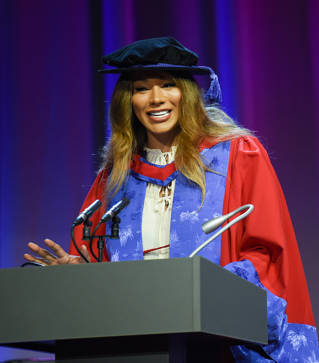 Munroe Bergdorf accepting her honorary doctorate