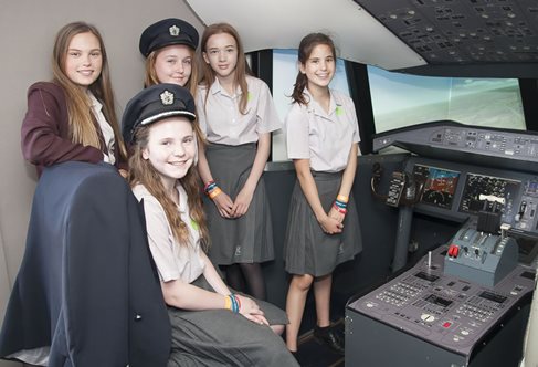 School students in a British Airways flight simulator