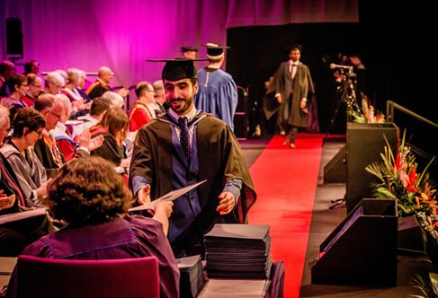 Students receiving their awards at the University of Brighton Winter Graduation