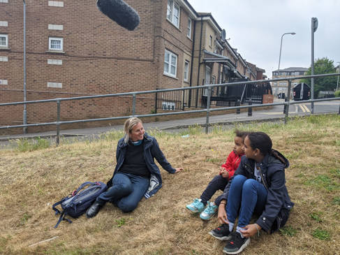 A 2m conversation on a grass bank