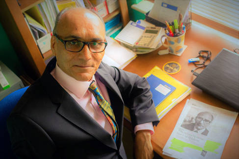 Professor Anjum Memon at his desk