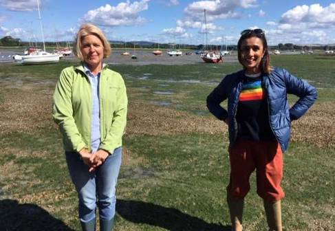 Dr Corina Coican and presenter Anita Rani with boats in the background 