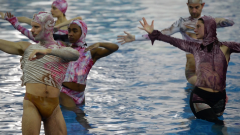 Five figures dancing in water
