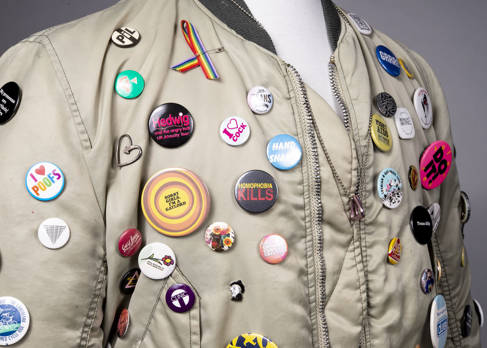 Jacket worn at anti-Section 28 demonstrations, loaned by community curator Daren Kay; badges and accessories loaned by private collector and community curator Alf Le Flohic