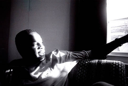 Justin Fashanu in his basement flat in Regency Square, Brighton, taken in 1986 by Kevin Weaver.