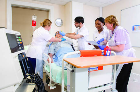 Nursing students in clinical skills room