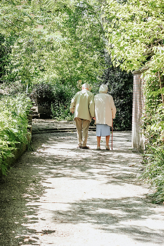 An elderly couple walking by Micheile Henderson on Unsplash
