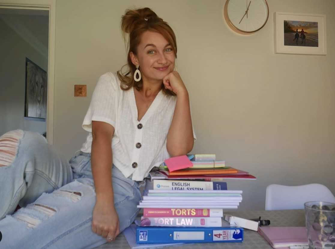 Jasmin Brown with law books