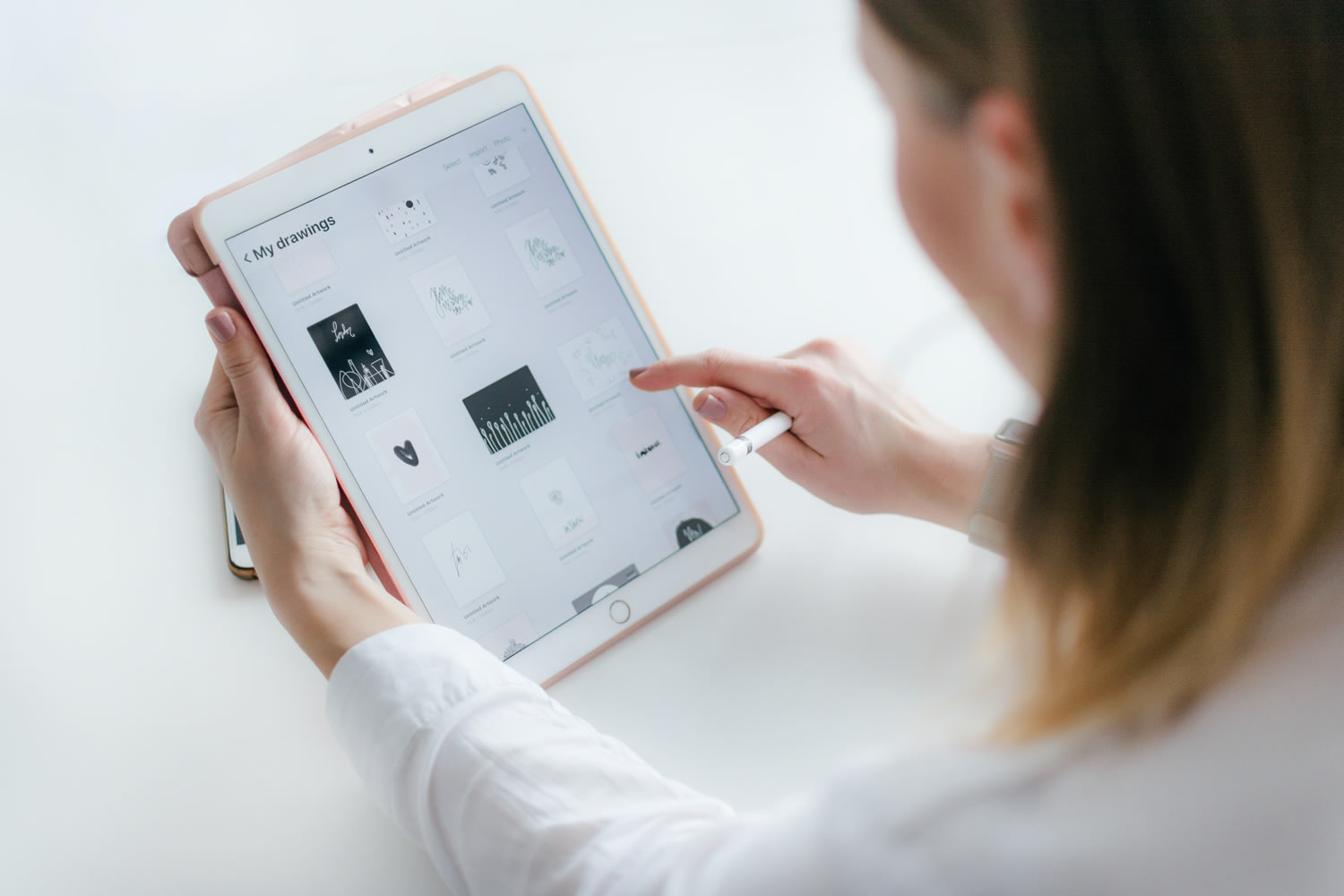 Photo of a woman using a  computer Tablet by Marek Levak on Unsplash