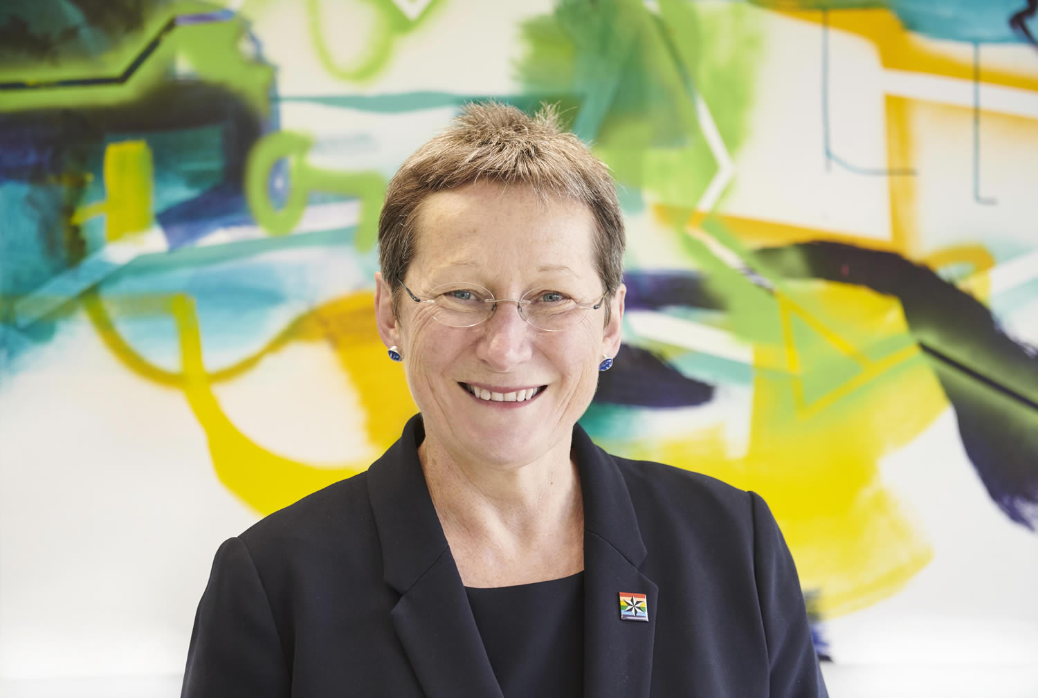 Professor Debra Humphris against a colourful background