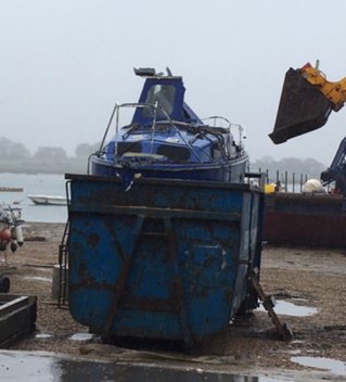 Abandoned boat being crushed at Chichester Harbour