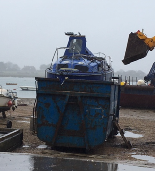 Abandoned boat being crushed at Chichester Harbour