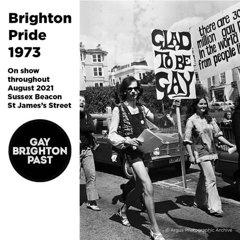 People on Brighton Pride march in 1973 with sign: Glad to be Gay