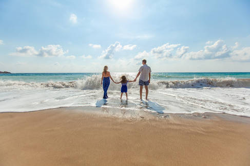 Family at the beach holding hands - picture courtesy Pexels via Pixabay