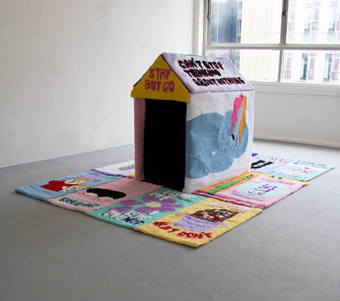 A soft playhouse in a gallery setting