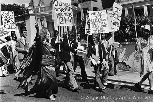 People on Brighton Pride 1973 march holding signs like: Did you wait until you were 21?