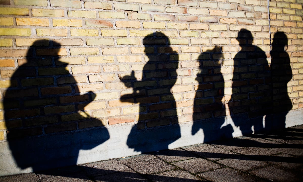 Girl gang members shadows on wall