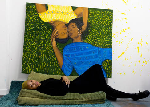 Sola Olulode in front of her painting Laying in the Grass