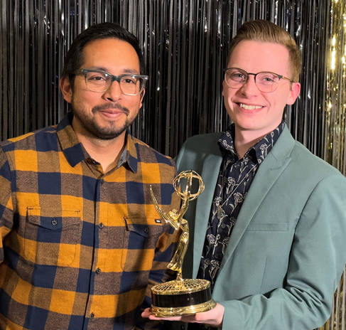 Jordan Hogan with Emmy Award, sharing the moment with photographer and editor colleague Manuel Rodriguez