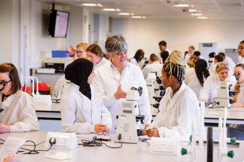 Students and lecturer in biomedical lab
