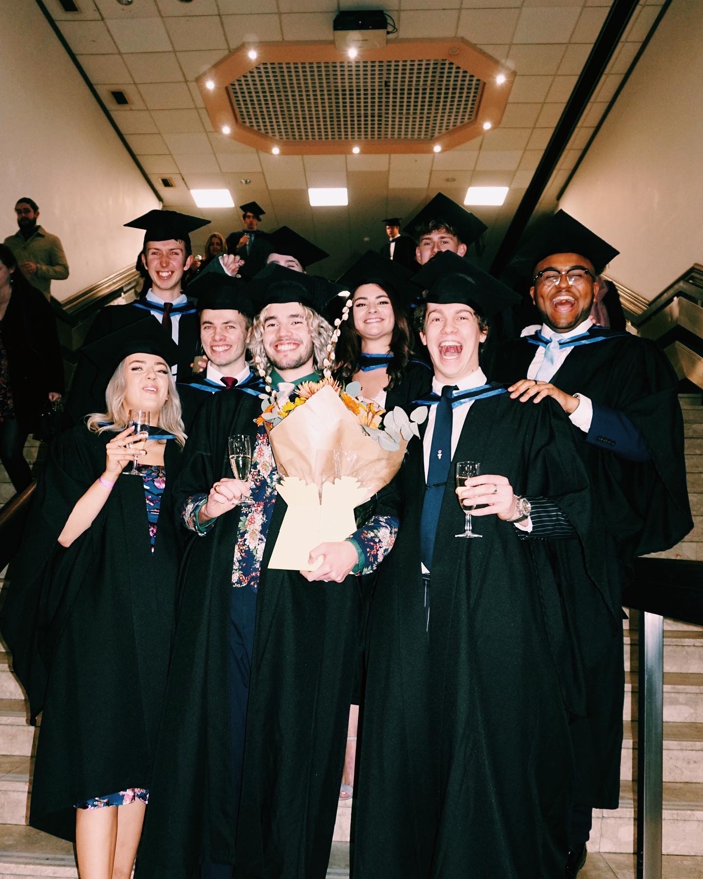 A group of graduates in gowns and hats