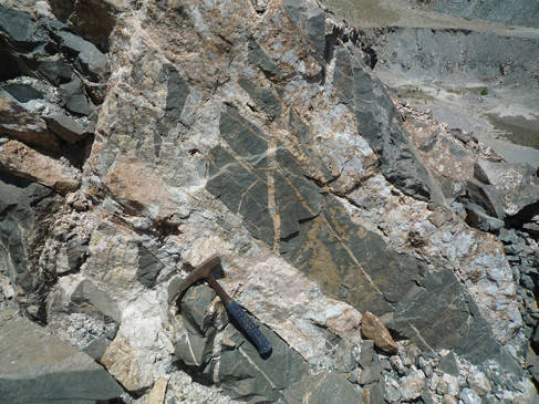 Rare earth element mineralised carbonatites cutting slate. Huanglongpu, China