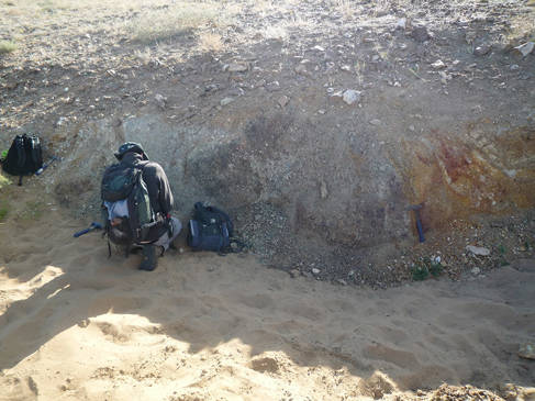 Researchers investigating weathered carbonatite in Mongolia