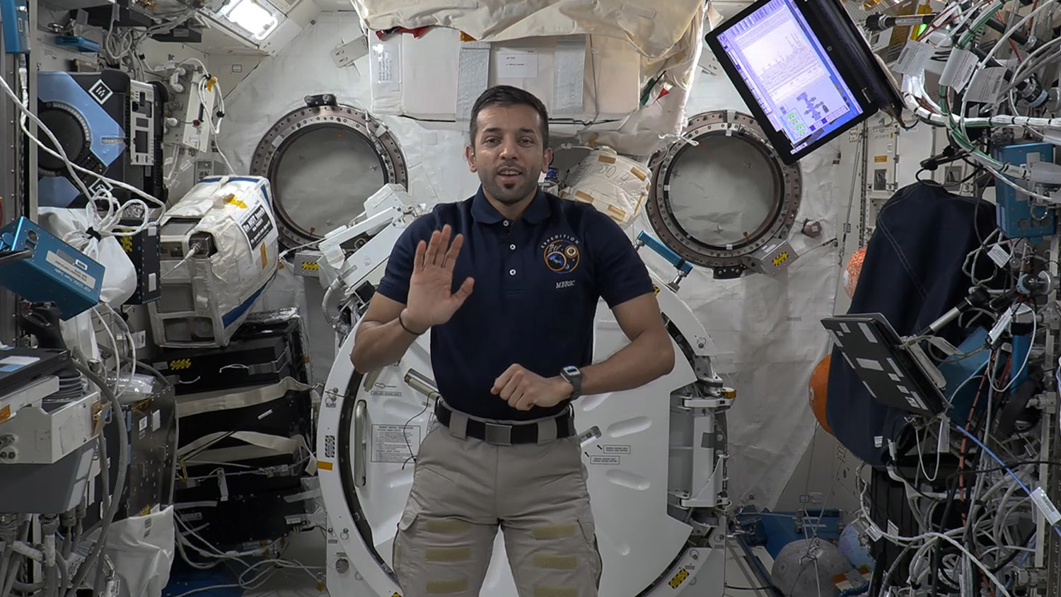 Sultan Al-Neyadi waving on the International Space Station