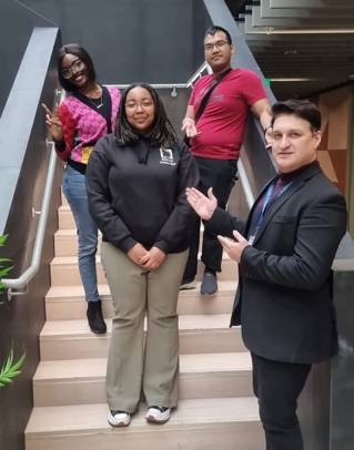 EDI Business Challenge team members on some stairs