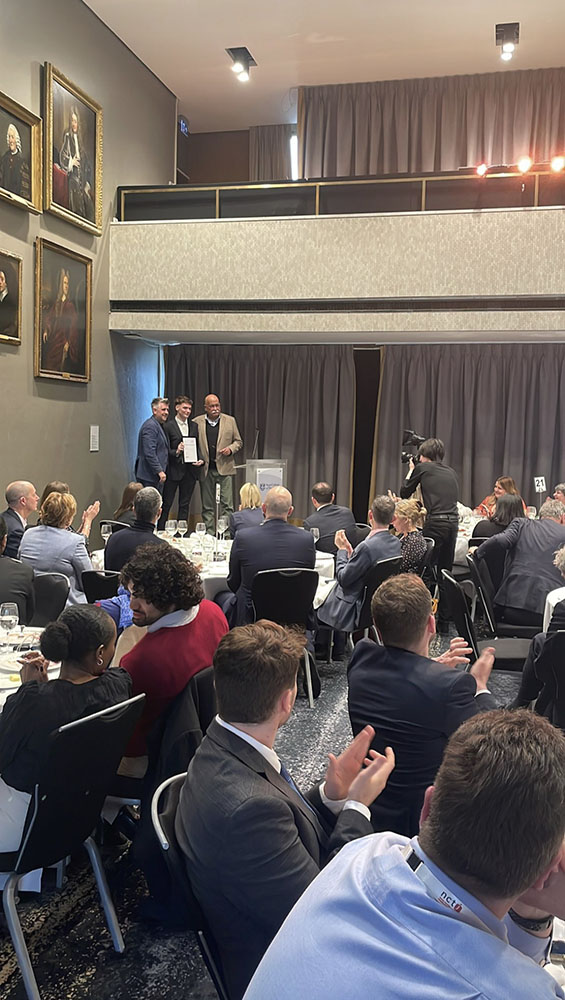 Leon Imber getting his award