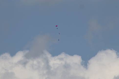 A small rocket in a blue and cloudy sky