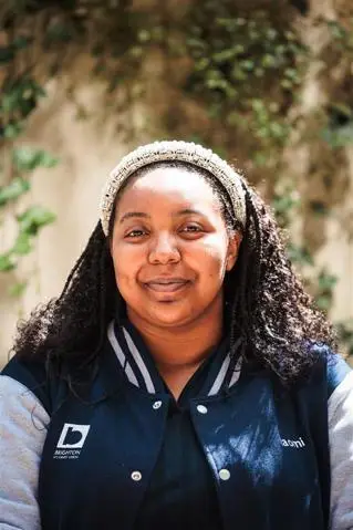 A young woman smiling (Naomi Spence)