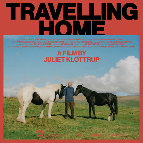 Film poster with the words 'Travelling Home' and a picture of a man with one white, and one black horse