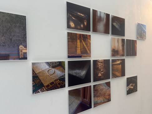 Printed images mounted on white wall 