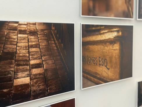 Exhibition images mounted on a wall
