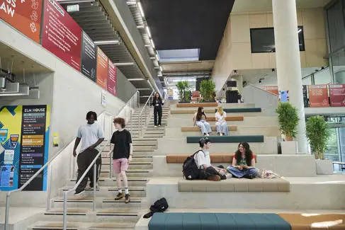Students descending stairs at Elm House