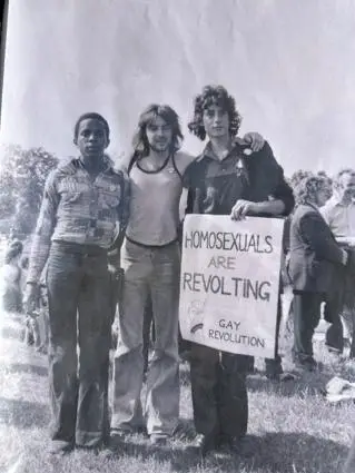 Three men with a banner that says Homosexuals are Revolting: Gay Liberation