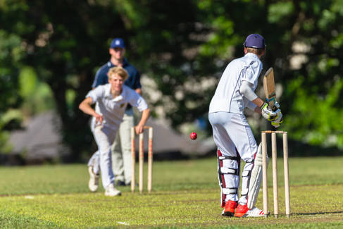 Three cricket players training